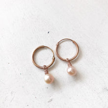 Load image into Gallery viewer, Orbit rose gold hoops with pink peach pearl charm earrings
