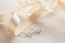 Load image into Gallery viewer, Celestial hoops with tiny star and moon charms earrings