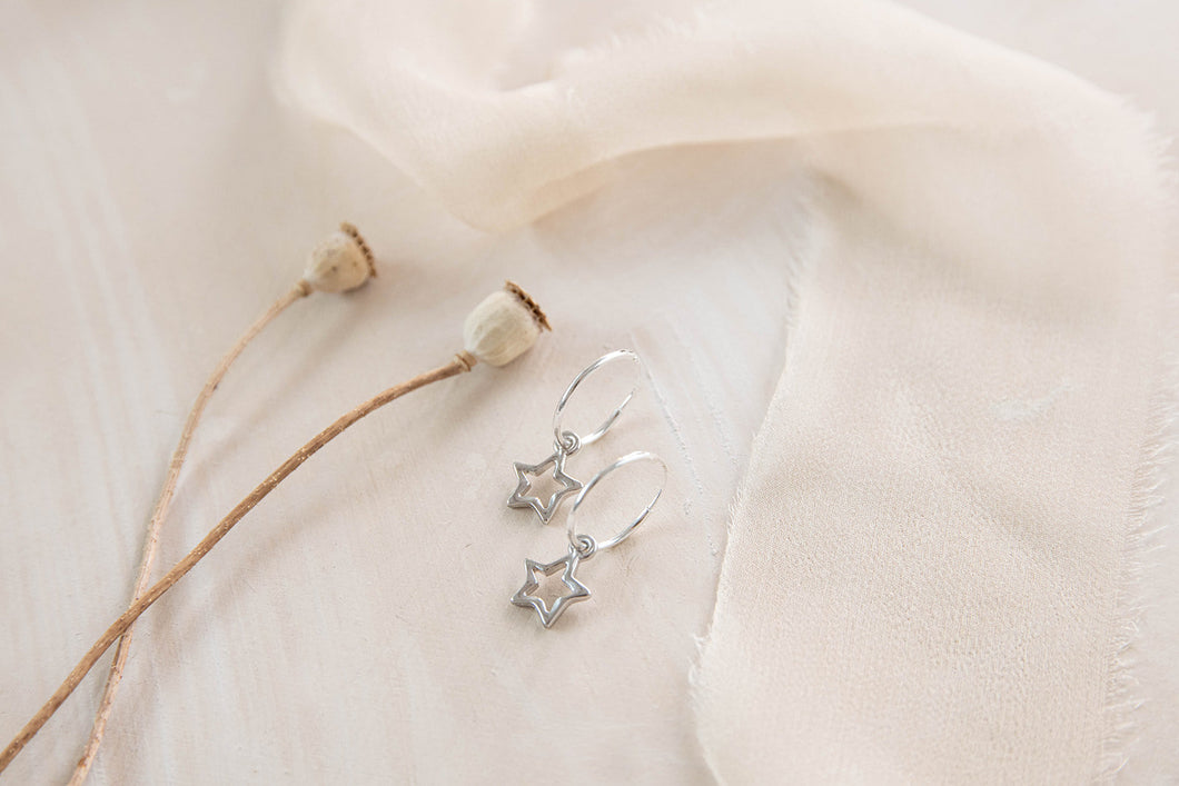 Celestial hoops with tiny star and moon charms earrings