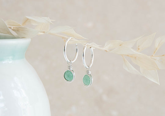 Infinity sterling silver hoop earrings with wire wrapped green Jade charm
