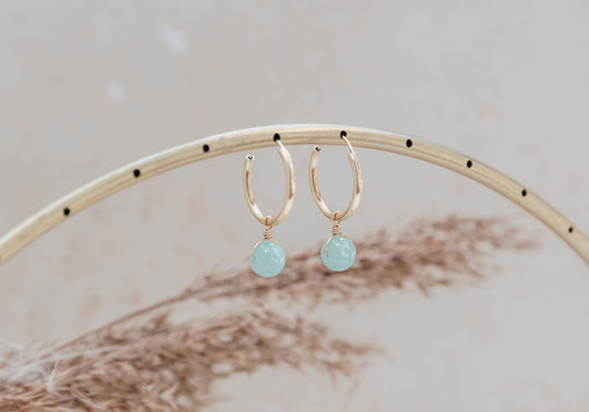 Orbit gold hoop earrings with pale aqua jade charm