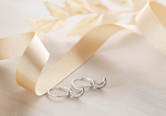 Celestial hoops with tiny moon and star charms earrings