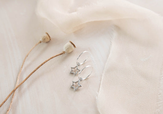 Celestial hoops with tiny star and moon charms earrings