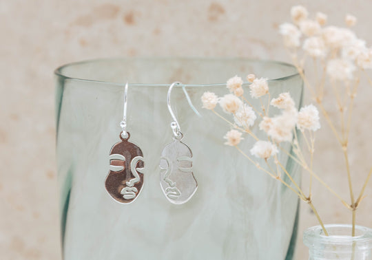 Serena small silver abstract face earrings