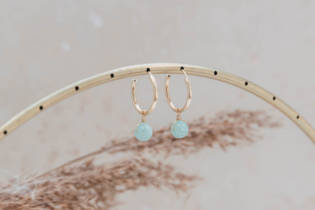 Orbit gold hoop earrings with pale aqua jade charm