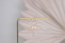 Load image into Gallery viewer, Orbit sterling silver hoops with pink peach pearl charm earrings
