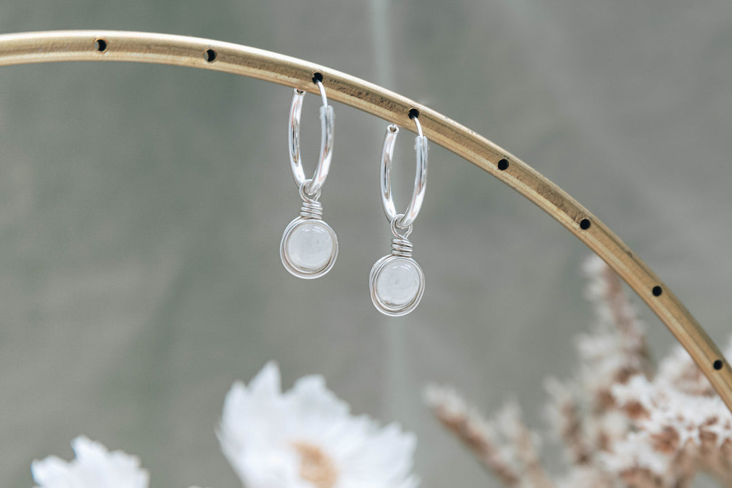Infinity silver hoop earrings with natural rainbow moonstone charm